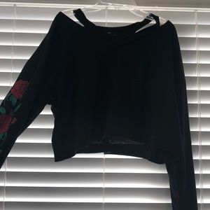 Black crop top, rose print on sleeves